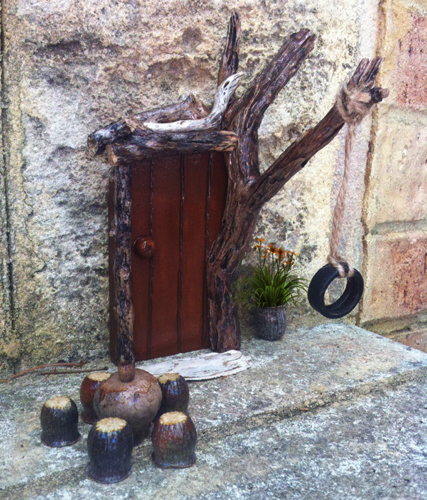 Fairy Door with a tyre swing. Fairy Door with a tyre swing.